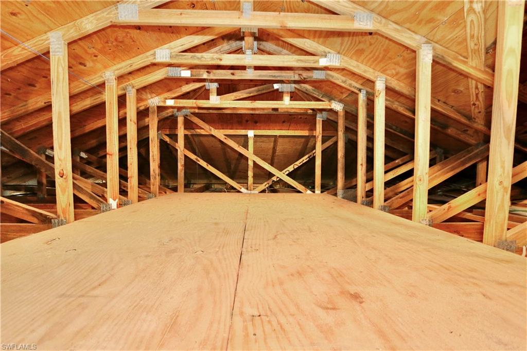 View of unfinished attic with plenty of room for storage