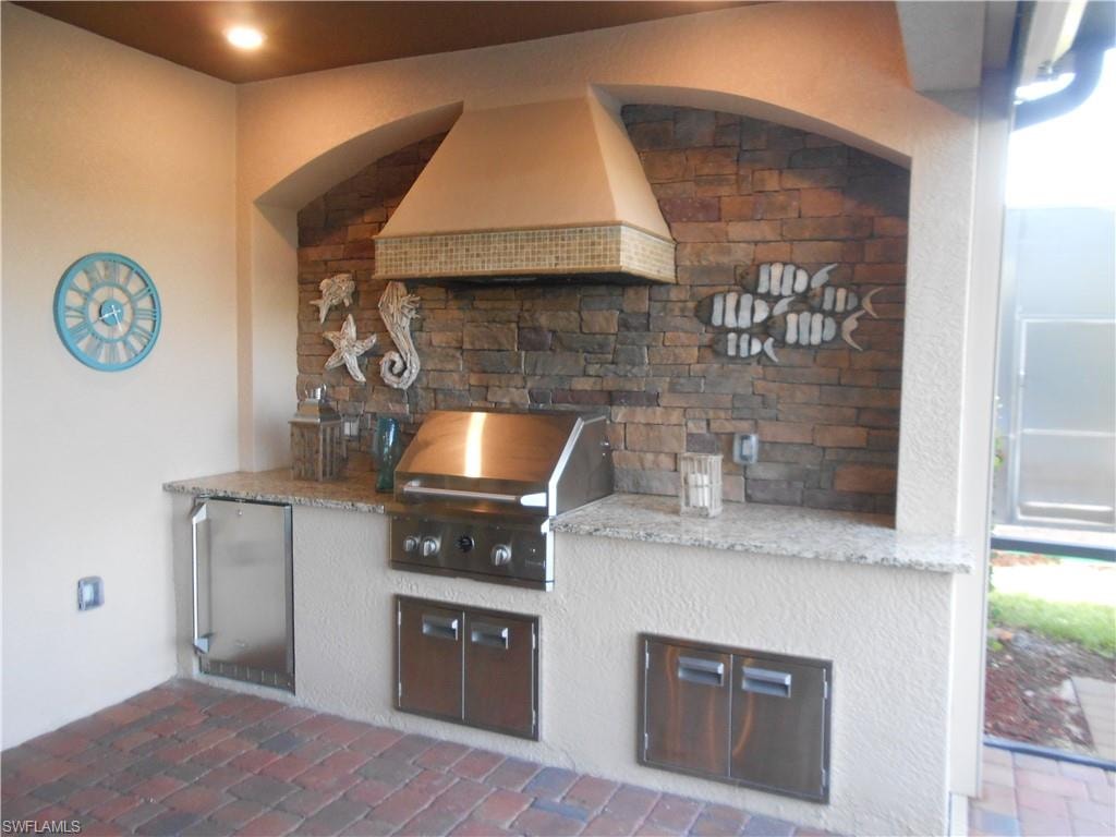 View of patio with exterior kitchen