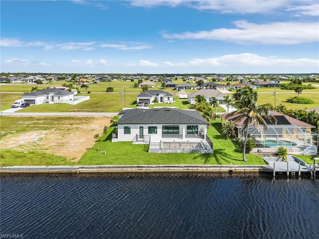 Aerial view of residential area with a nearby body of water