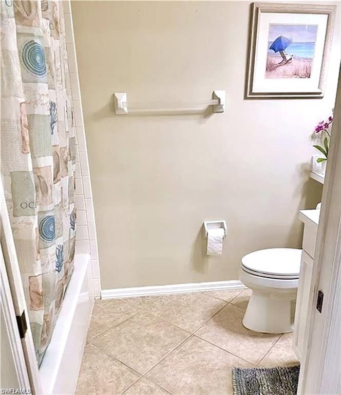 Bathroom featuring a white bathtub, ceramic tile flooring, and light-toned walls