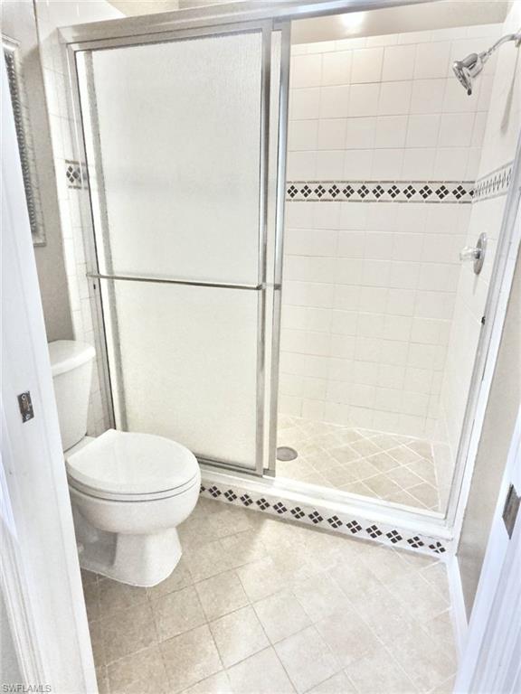 Shower enclosure with frosted glass panels and chrome-finish framing