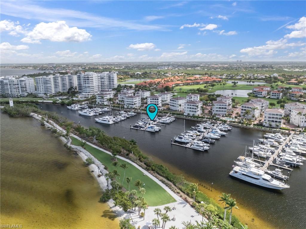 Drone / aerial view of a nearby body of water and numerous boat docks