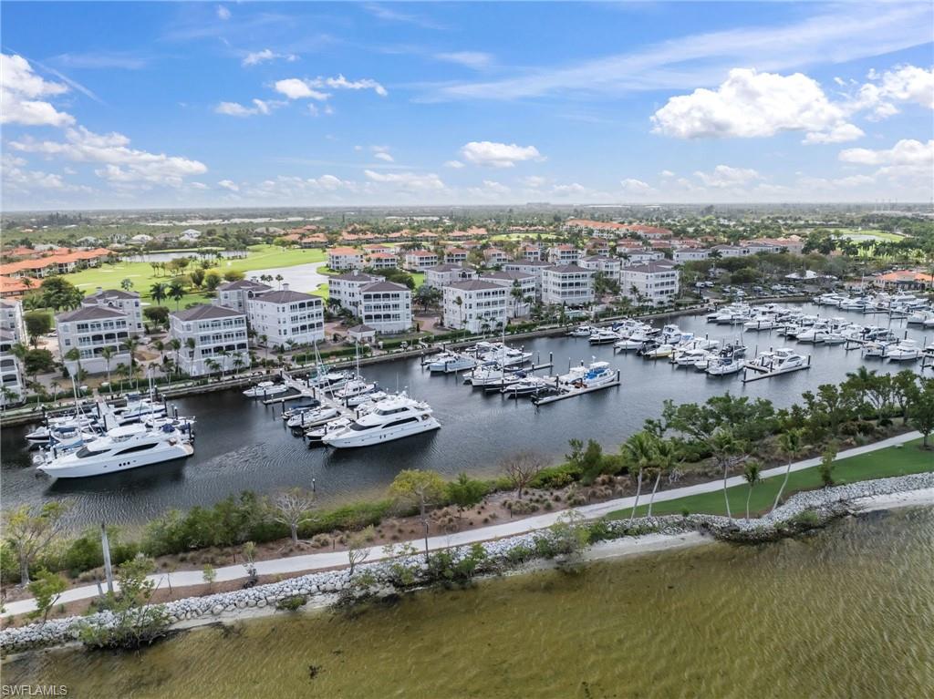 Aerial view of numerous boat docks and a large body of water