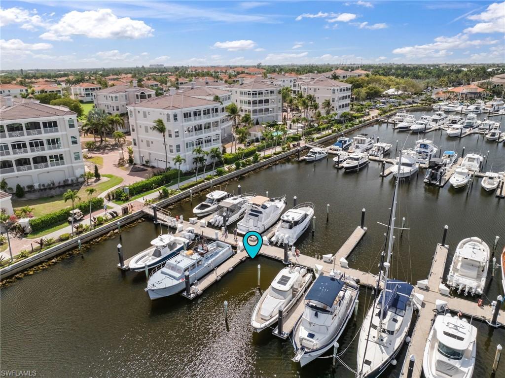 Bird's eye view of a nearby body of water and numerous boat docks