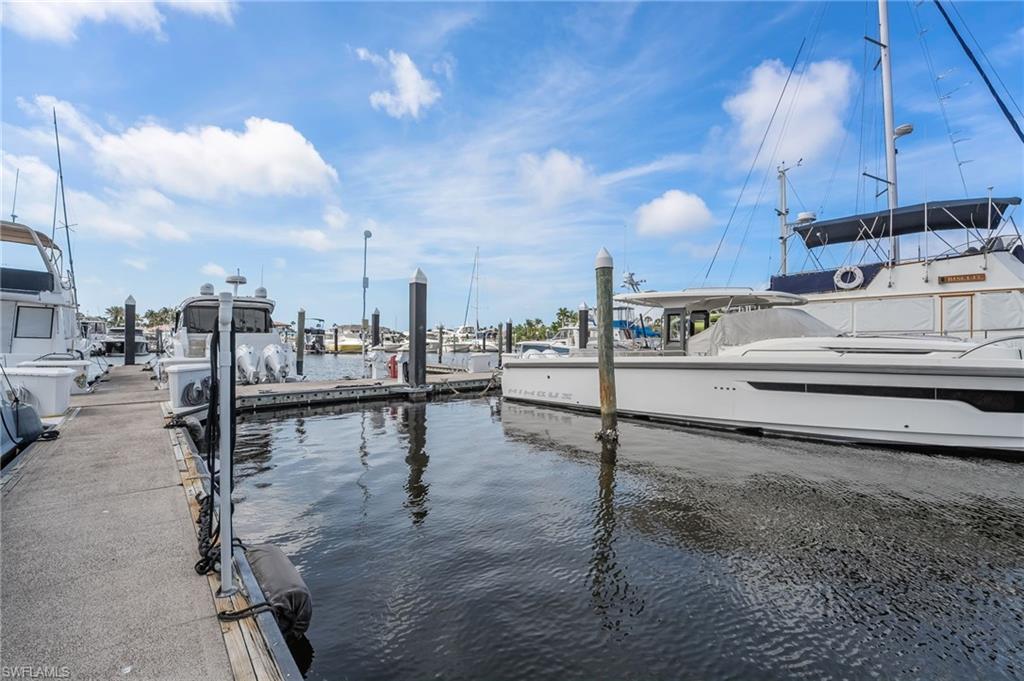 Dock area featuring a water view