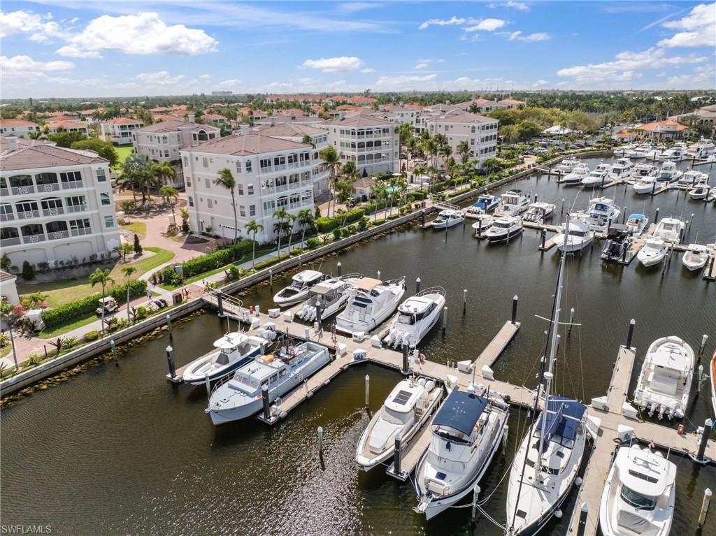 Aerial view of a nearby body of water and numerous boat docks