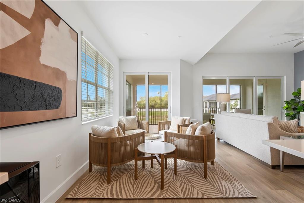 Sitting room featuring ceiling fan and light hardwood / wood-style floors