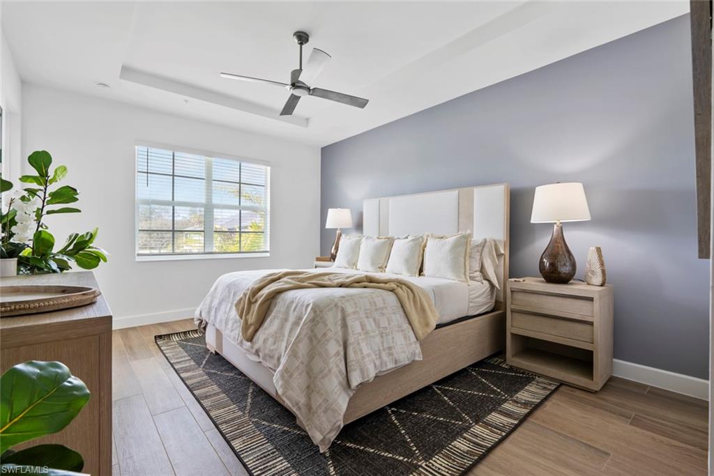 Bedroom featuring light wood-type flooring and ceiling fan