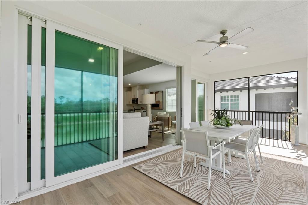 Sunroom / solarium with ceiling fan and a healthy amount of sunlight