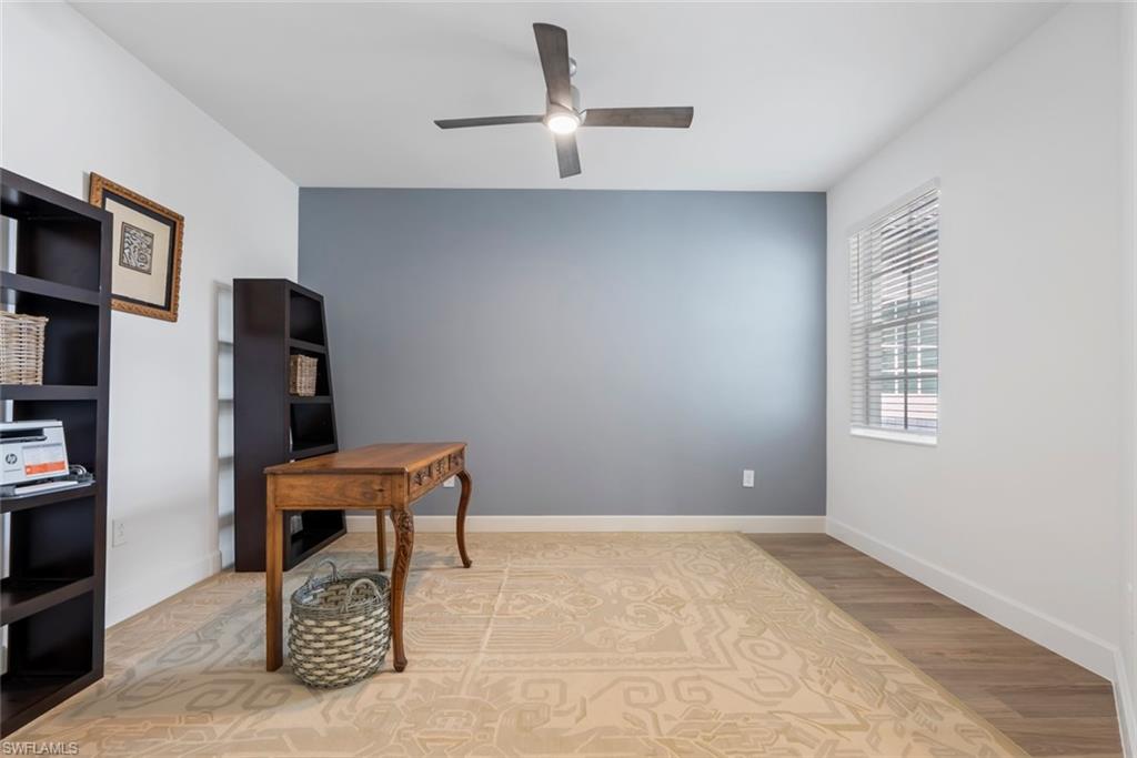 Office space featuring ceiling fan and hardwood / wood-style floors