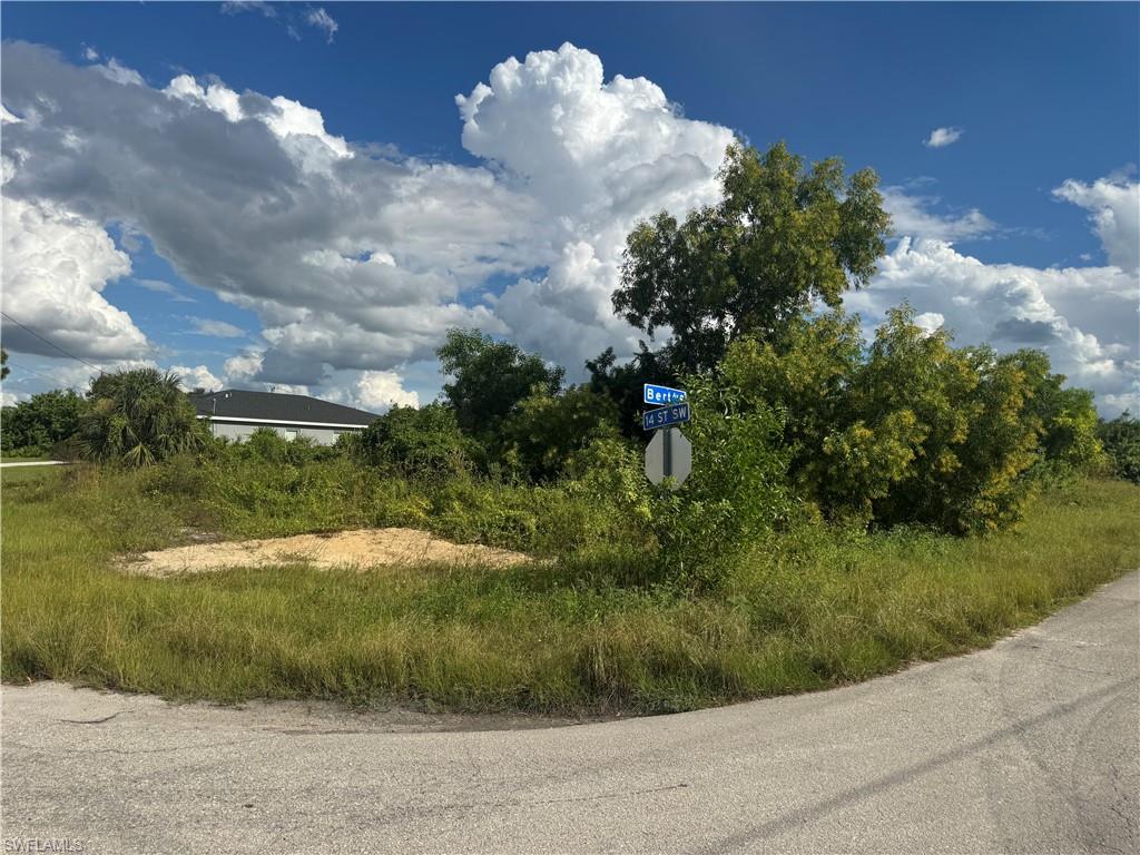 View of asphalt road featuring traffic signs