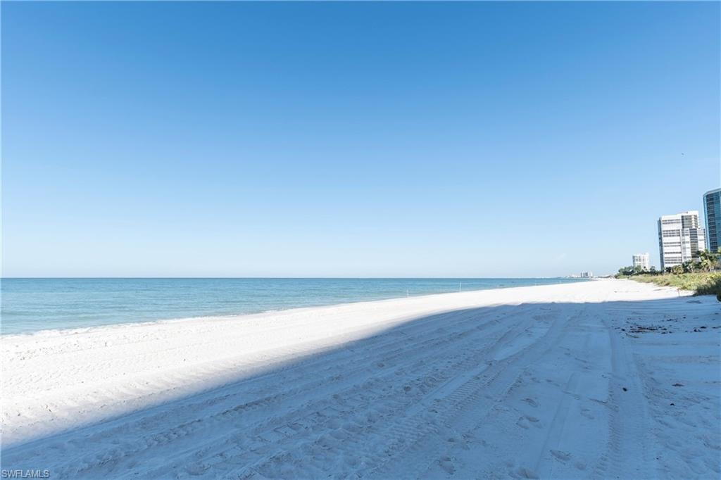Property view of water featuring a beach view