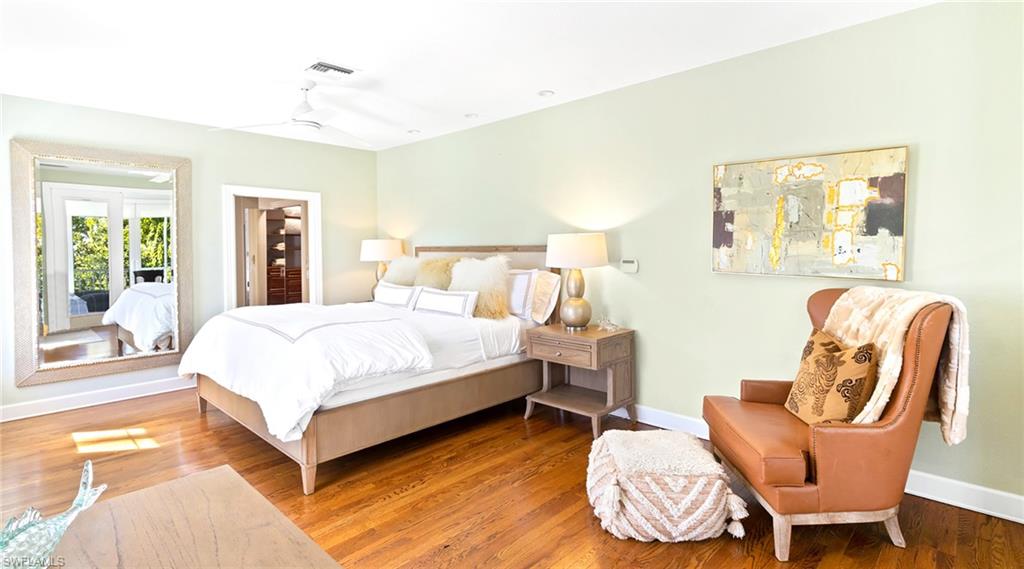 Bedroom with wood finished floors and a ceiling fan