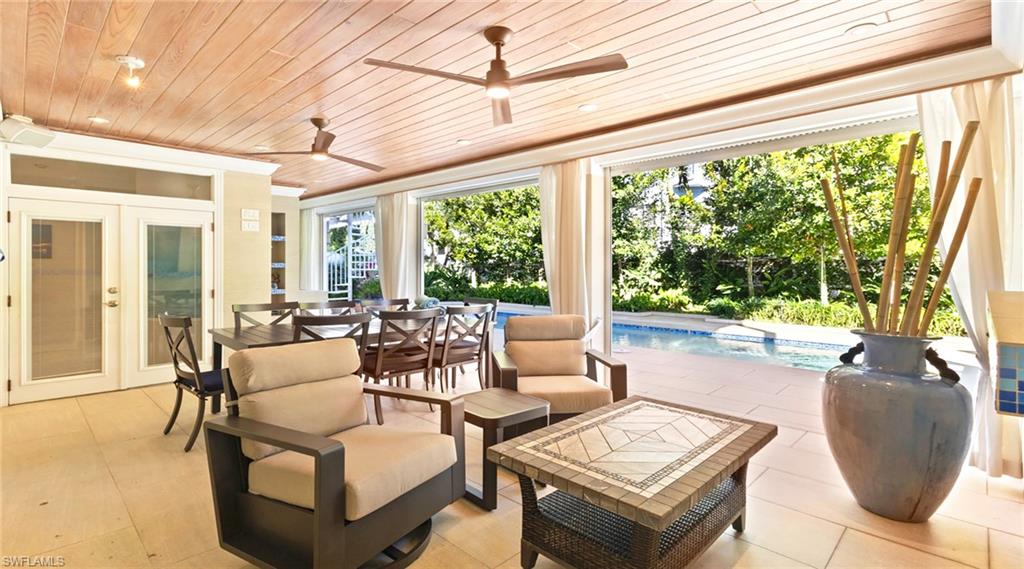 View of patio featuring an outdoor pool, ceiling fan, an outdoor hangout area, and french doors