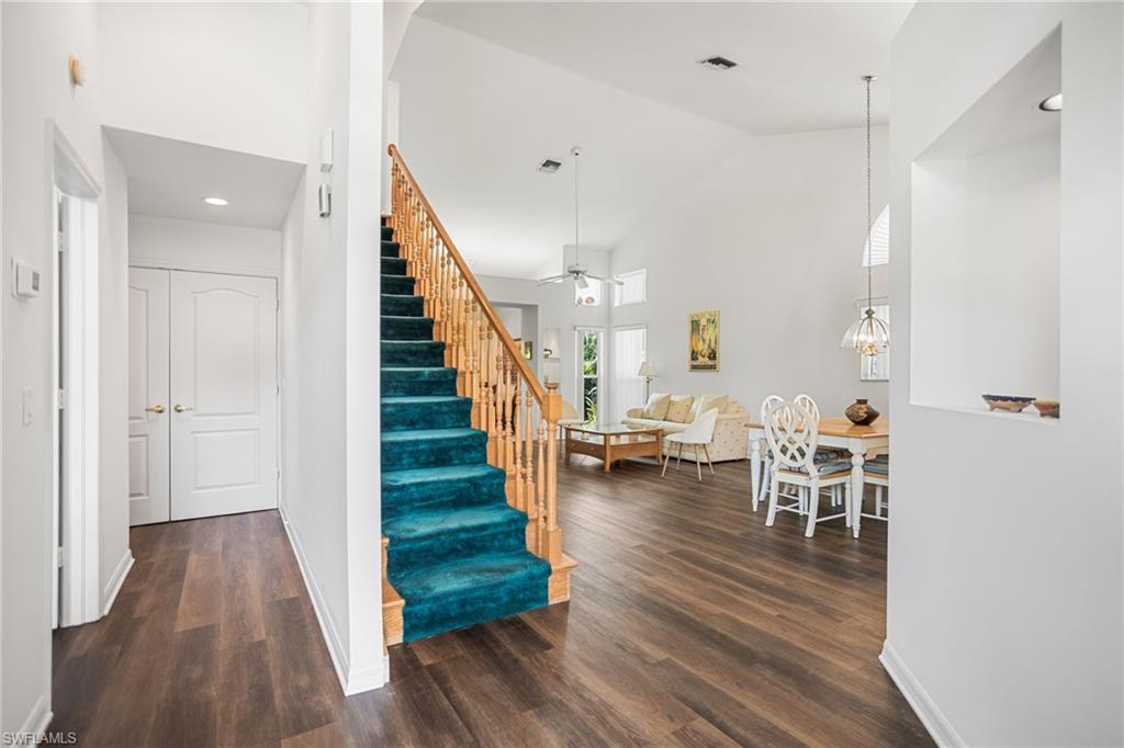 The entry offers a broad view of the home, with easy paths of travel to the great room, kitchen, guest room, and upstairs.
