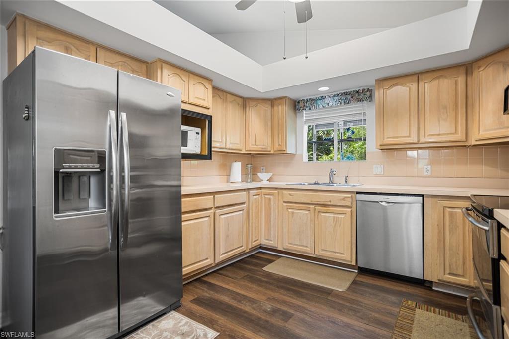 The spacious kitchen has stainless appliances, plenty of cabinet space and a floor-to-soffitpantry. The ceiling vaults up toward the greatroom, allowing more light in and the sense of even more space. The soffits are open above, meaning no load-bearing walls to worry about, if you want to open up the space to the great room.