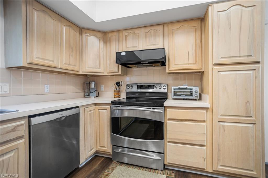 The spacious kitchen has stainless appliances, plenty of cabinet space and a floor-to-soffitpantry. The ceiling vaults up toward the greatroom, allowing more light in and the sense of even more space. The soffits are open above, meaning no load-bearing walls to worry about, if you want to open up the space to the great room.
