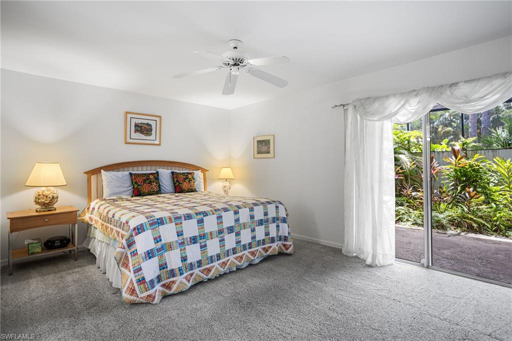 The first-floor primary suite has room for a king bedroom set plus sitting area, and has direct access to the screened lanai.