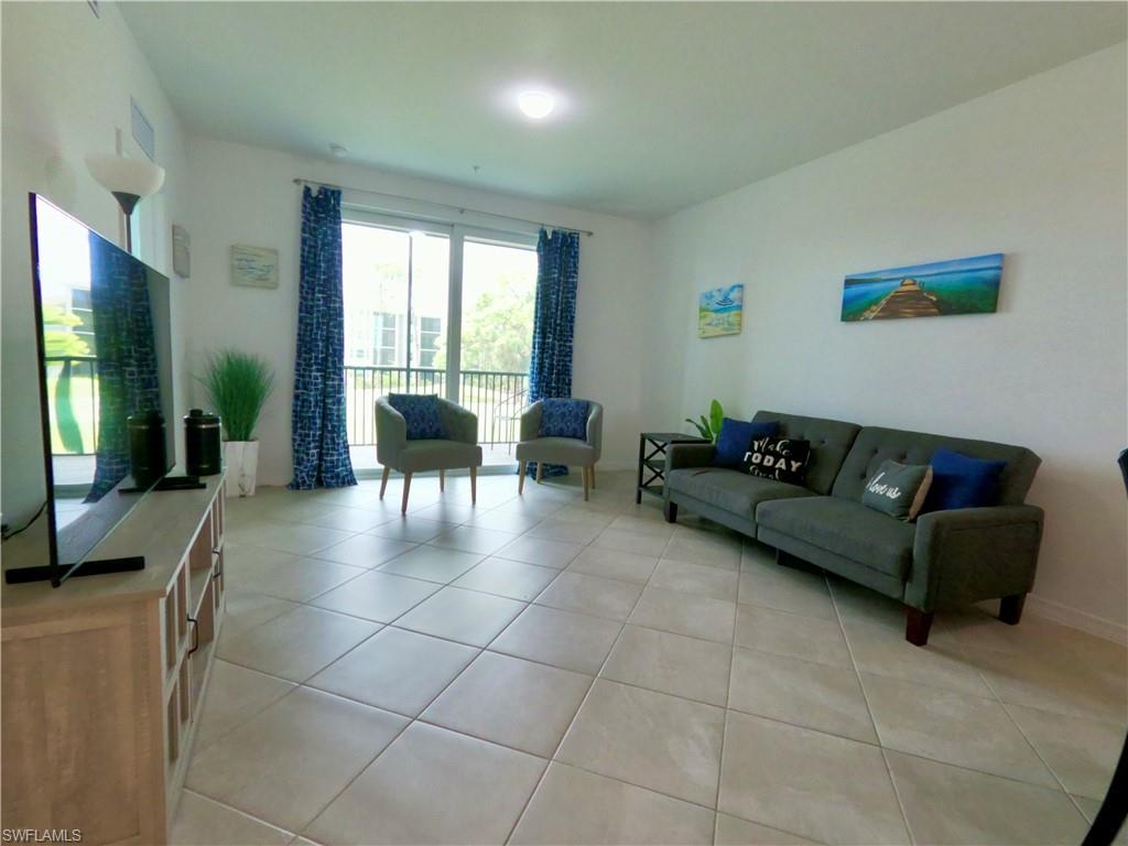 Living area with light tile patterned flooring