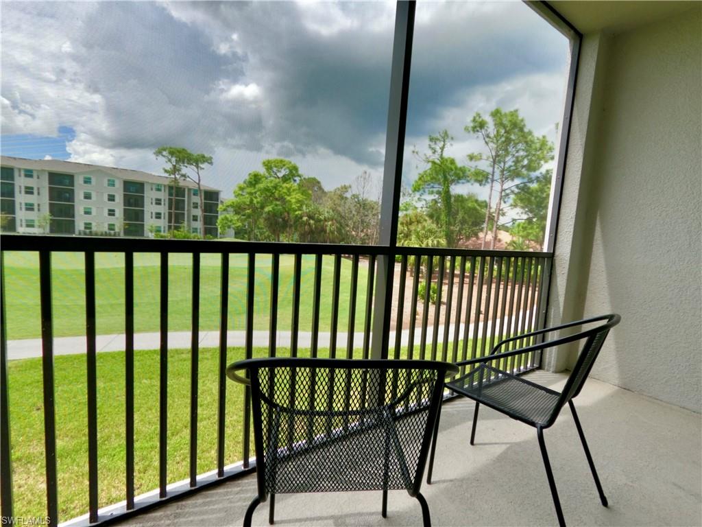 Balcony featuring a sunroom