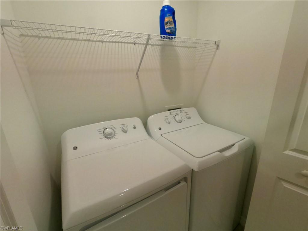 Laundry area with washing machine and clothes dryer