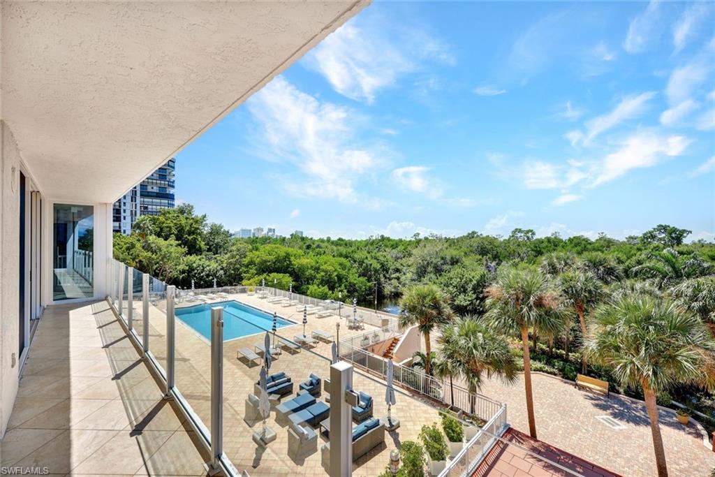View of large pool from 2nd floor balcony offering amazing sunsets every night!