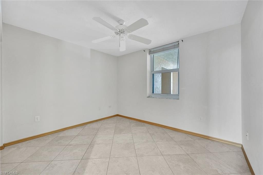 2nd Bedroom with light tile patterned floors and a ceiling fan
