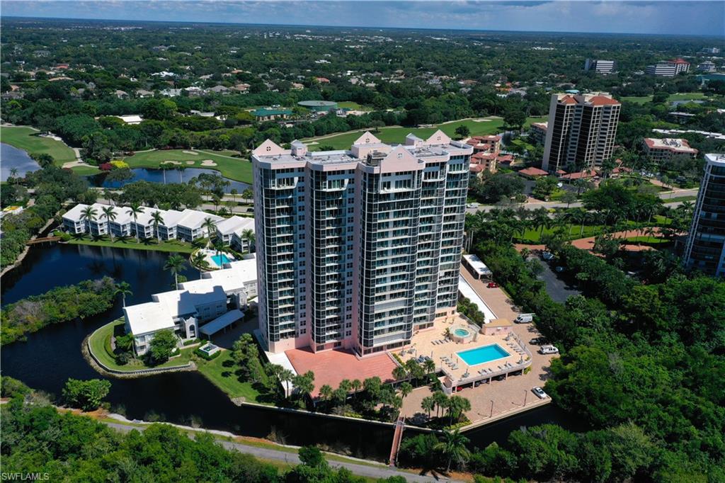 Aerial view of apartment complex / building and a large body of water