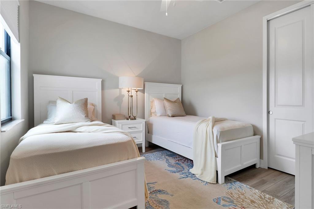 Bedroom with light wood-style flooring and ceiling fan