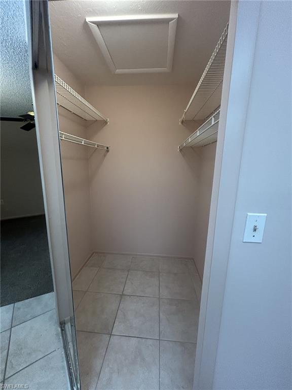 Primary bedroom walk in closet