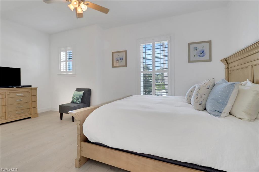 Bedroom with light wood-type flooring and ceiling fan