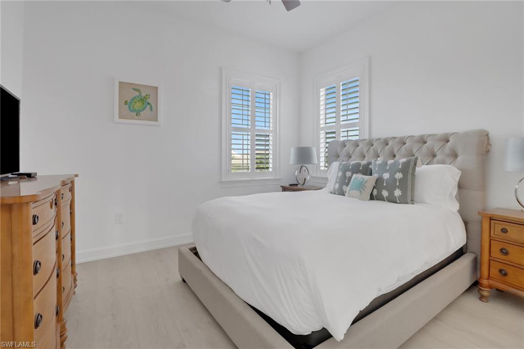Bedroom featuring ceiling fan and light wood-type flooring