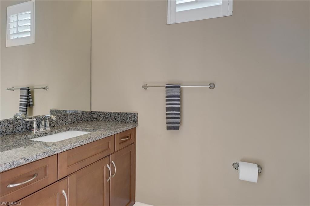Bathroom with vanity and a skylight