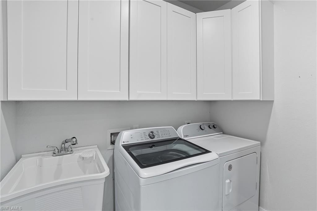 Laundry area with cabinet space and washer and dryer