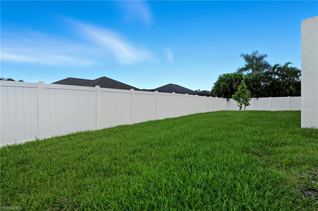 View of fenced backyard