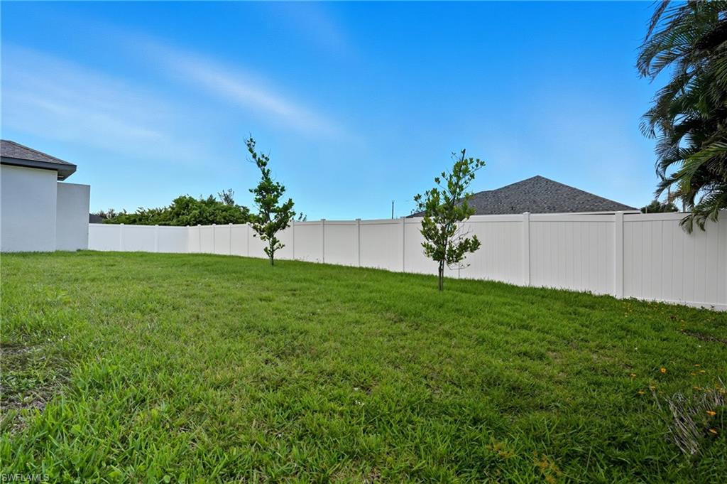 View of fenced backyard