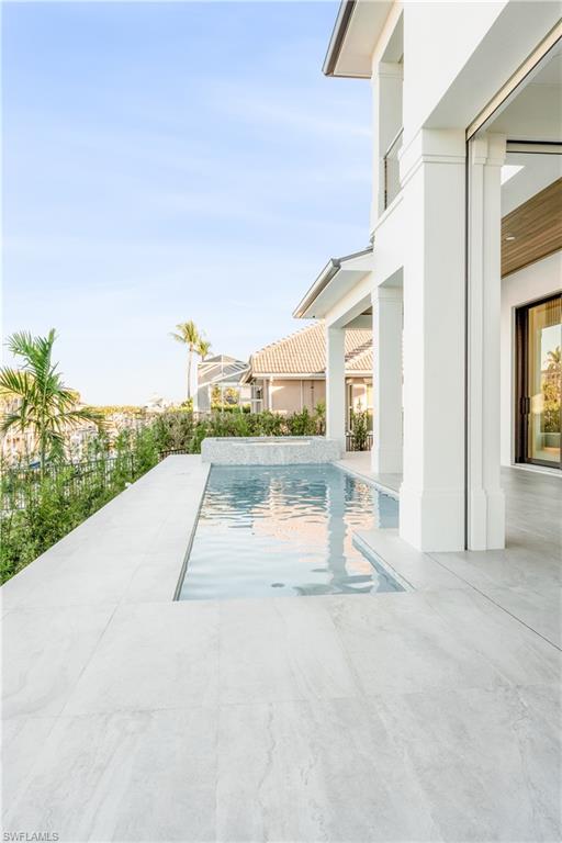 View of swimming pool with patio surround