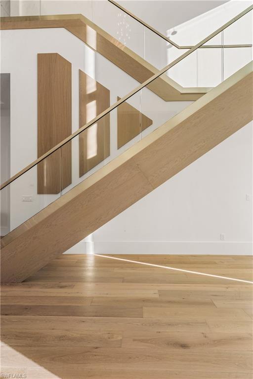 Stairway with hardwood / wood-style floors