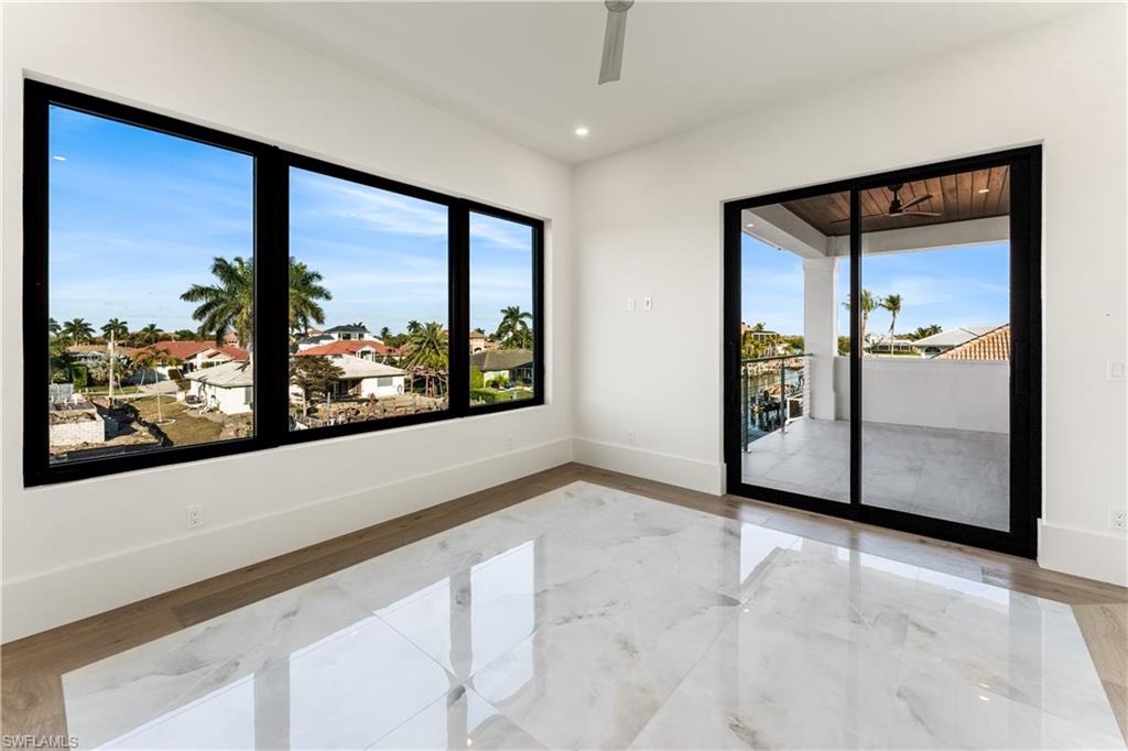 Spare room with recessed lighting, light marble finish flooring, and ceiling fan