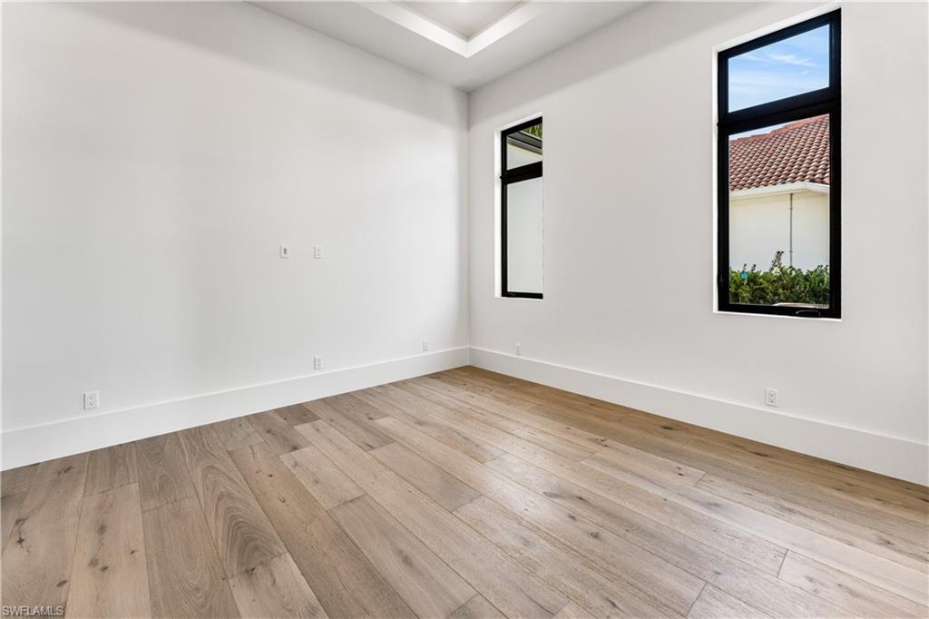 Spare room with light wood finished floors and baseboards