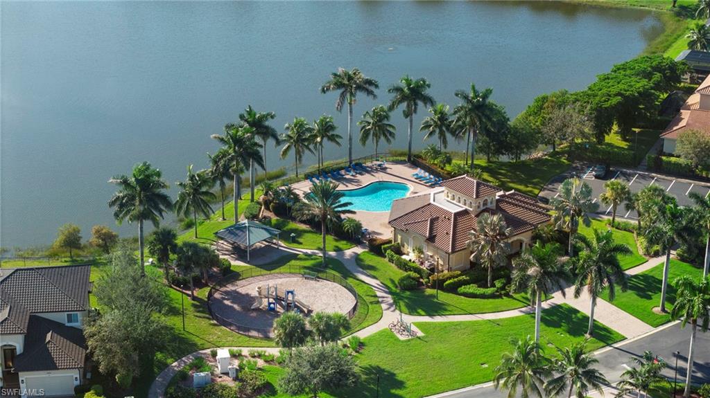 Aerial view of a pool and a nearby body of water