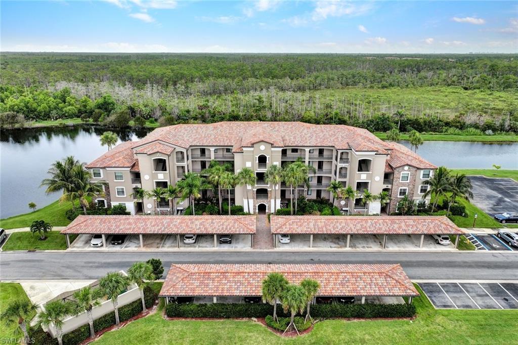Bird's eye view of apartment complex and a nearby body of water