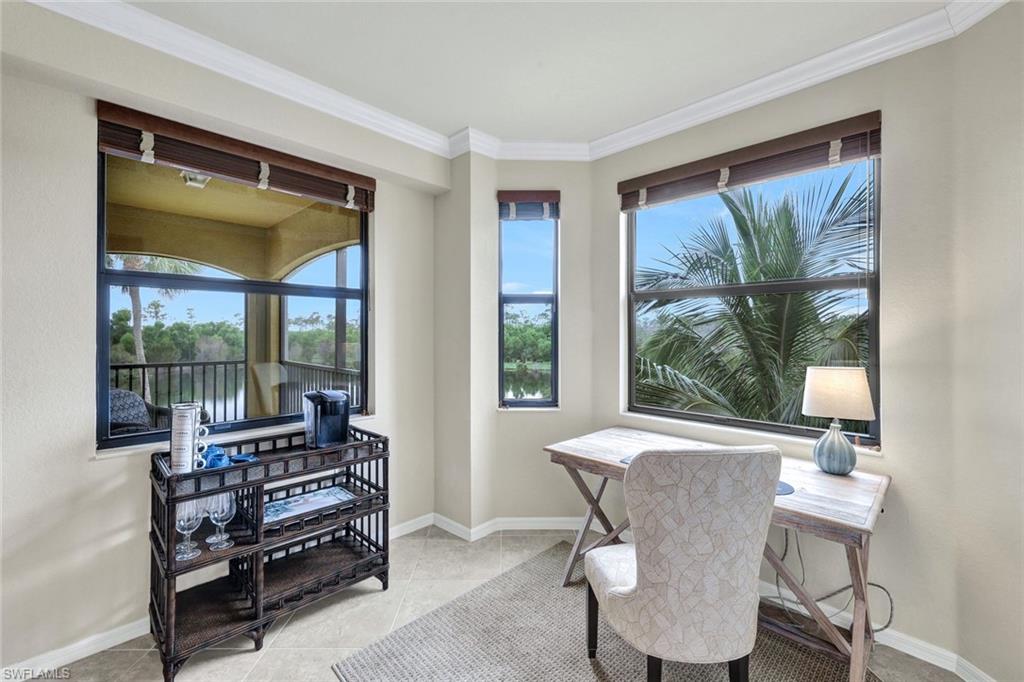 Office area featuring ornamental molding and light tile patterned floors