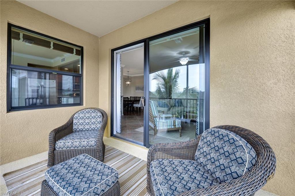 Balcony featuring a sunroom