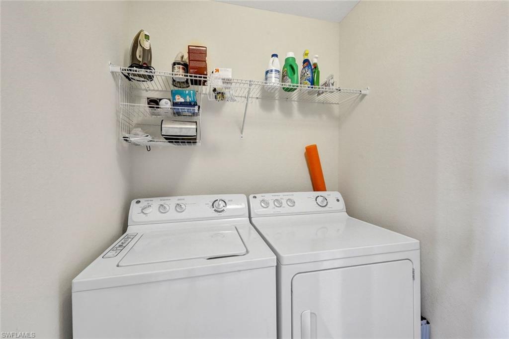Washroom featuring independent washer and dryer