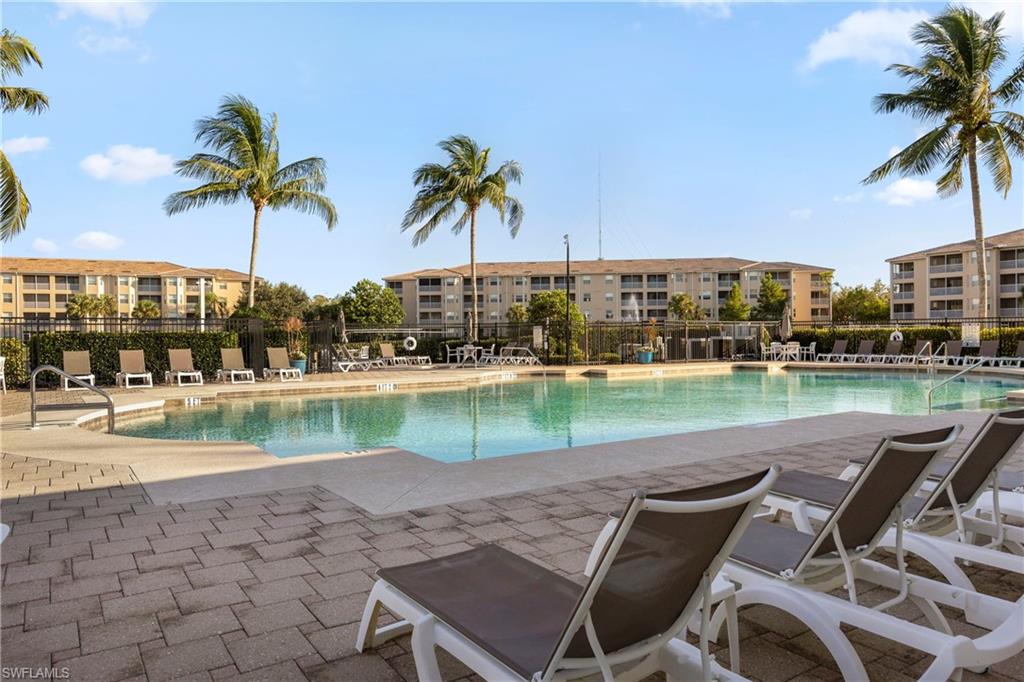Community pool featuring a patio