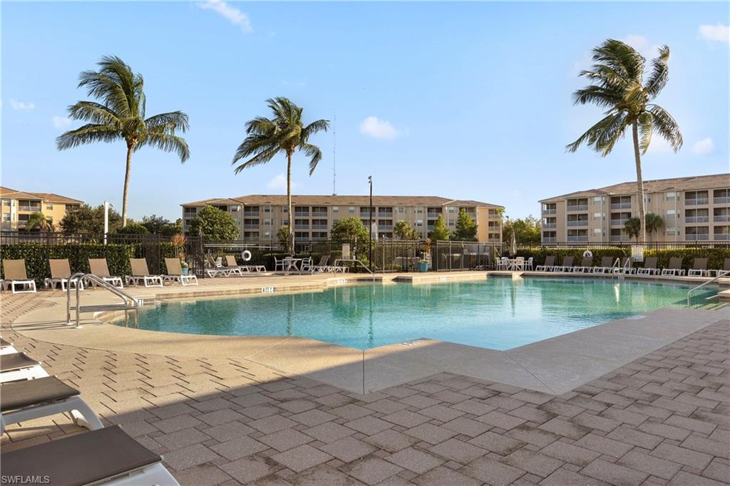 Community pool with a patio