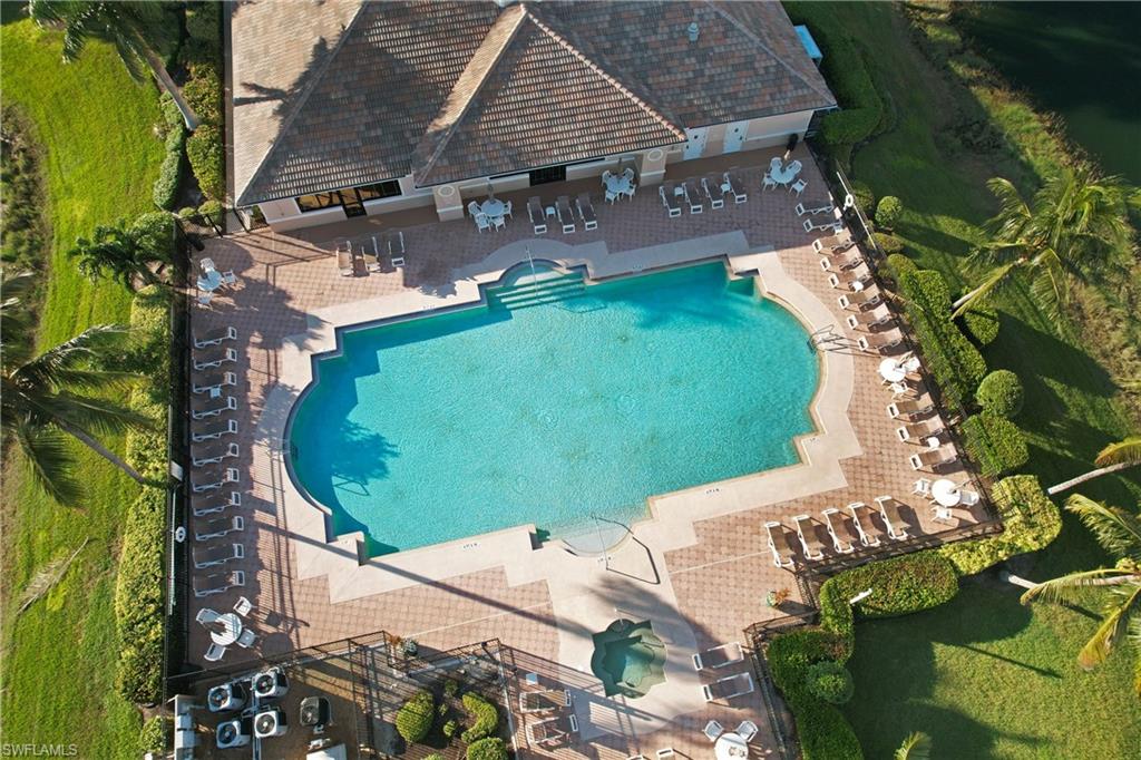 Aerial view of property and surrounding area with a pool