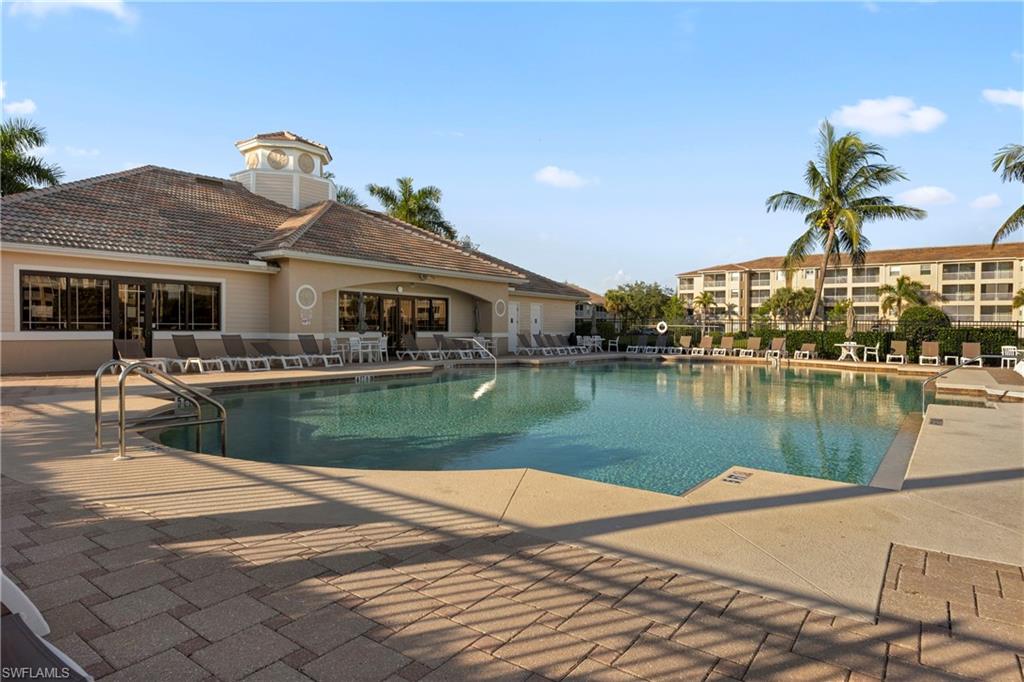 Community pool featuring a patio