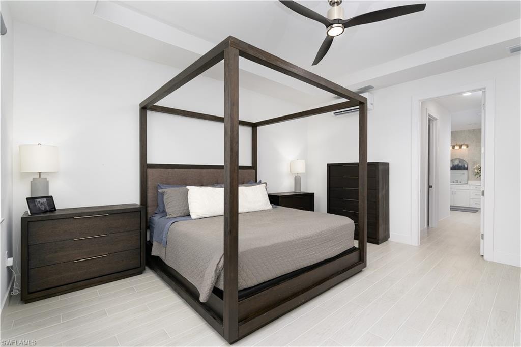 Bedroom with light wood-type flooring and a ceiling fan